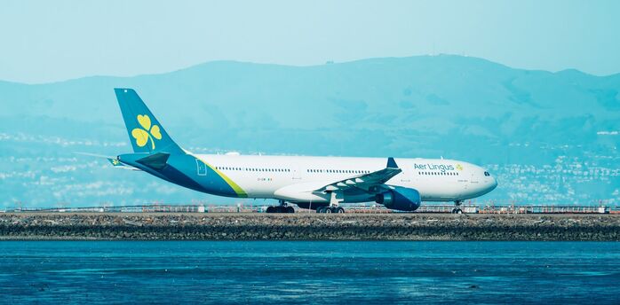 Aer Lingus aircraft parked near airport runway