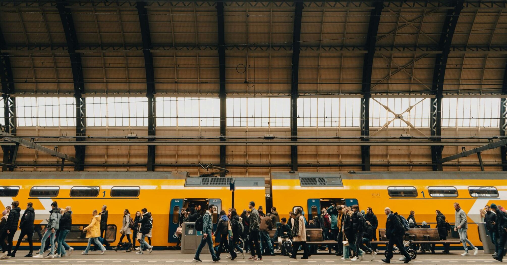 Rail passengers boarding a train at a station