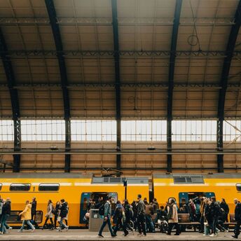 Rail passengers boarding a train at a station