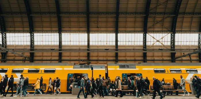 Rail passengers boarding a train at a station