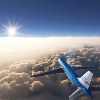 KLM aircraft flying above the clouds