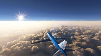 KLM aircraft flying above the clouds