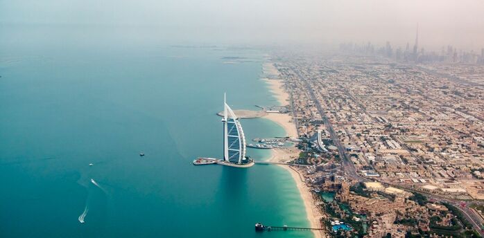 Aerial view of Burj Al Arab and Dubai coast