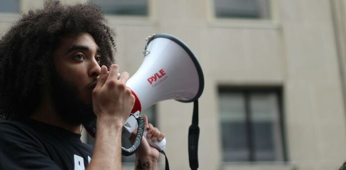 Protester speaking into a megaphone