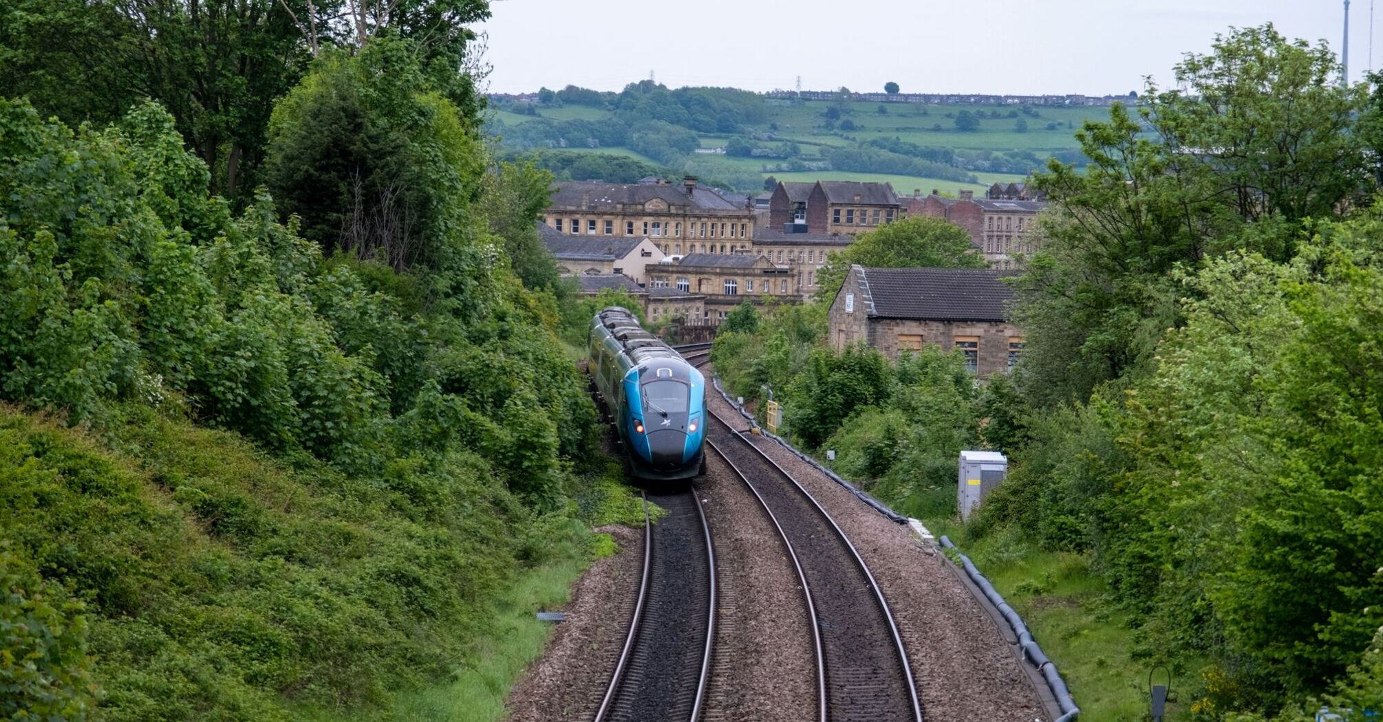 Passenger train travelling through the English countryside