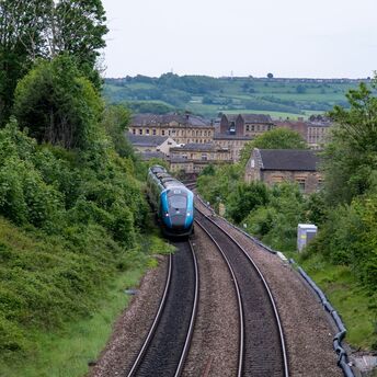Passenger train travelling through the English countryside