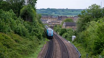 Passenger train travelling through the English countryside