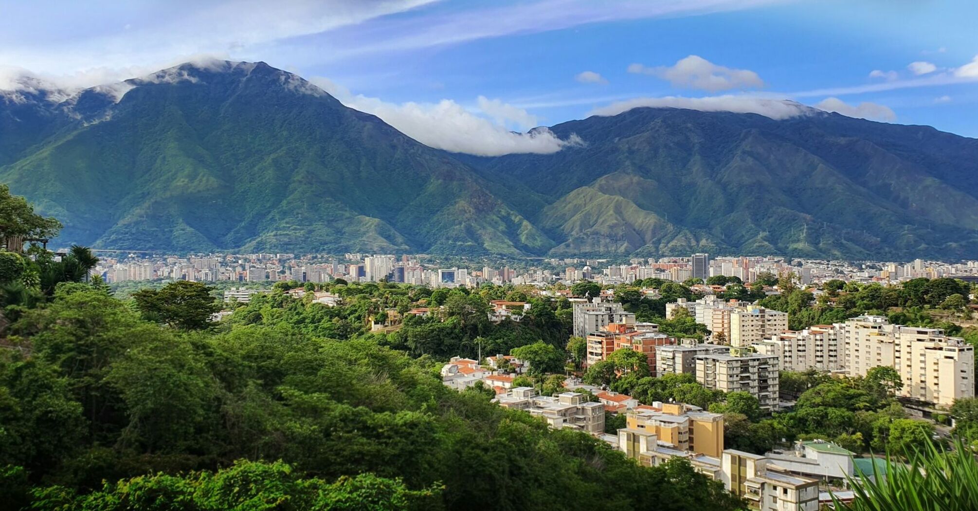 Caracas skyline beneath green mountains