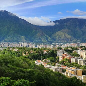 Caracas skyline beneath green mountains