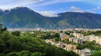 Caracas skyline beneath green mountains