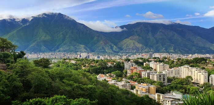 Caracas skyline beneath green mountains