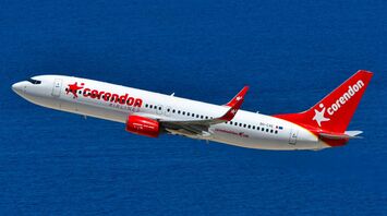 Corendon Airlines aircraft flying over the sea