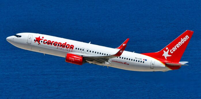 Corendon Airlines aircraft flying over the sea