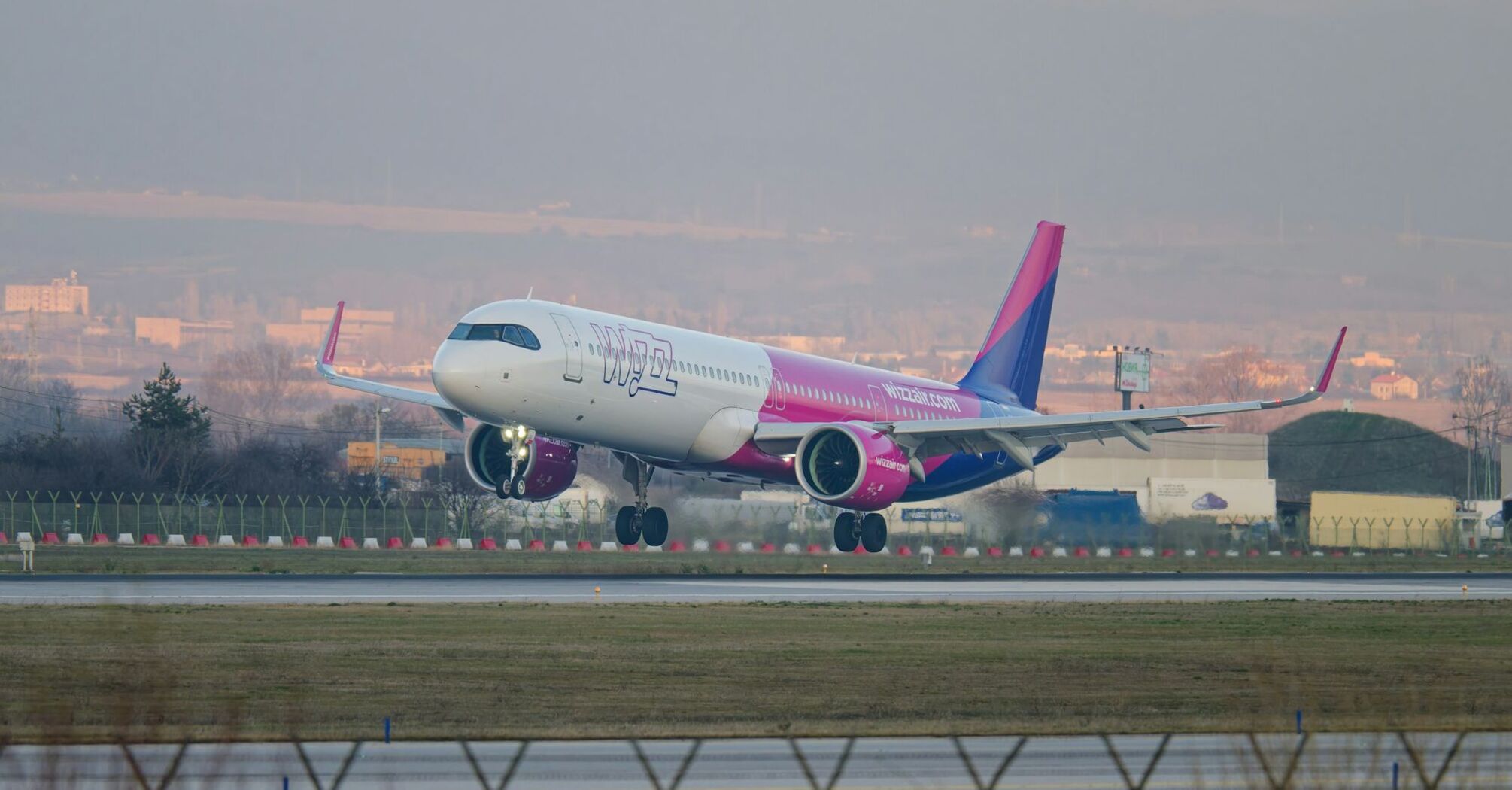 Wizz Air aircraft landing at an airport