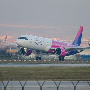 Wizz Air aircraft landing at an airport