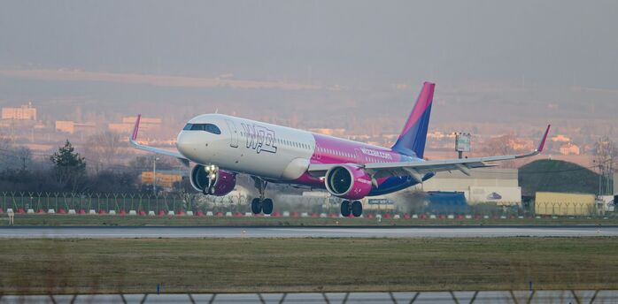 Wizz Air aircraft landing at an airport