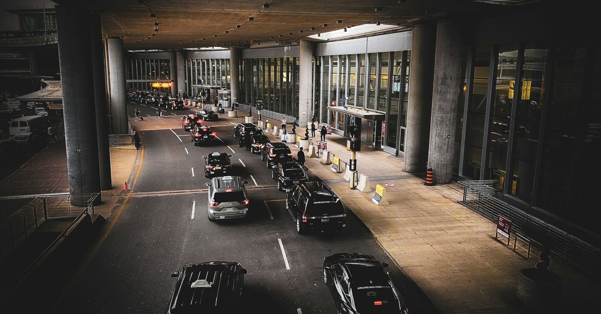 Cars using an airport terminal drop-off lane