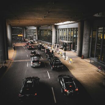 Cars using an airport terminal drop-off lane