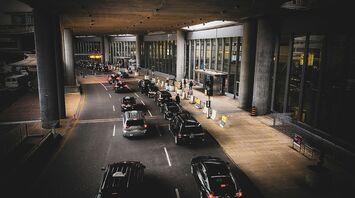 Cars using an airport terminal drop-off lane