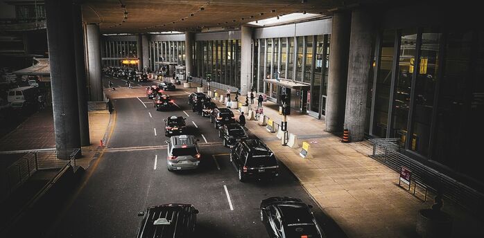 Cars using an airport terminal drop-off lane
