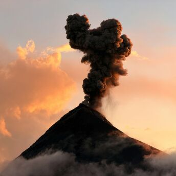 Volcanic ash plume rising from a volcano