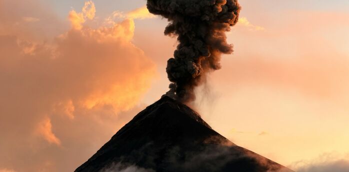 Volcanic ash plume rising from a volcano